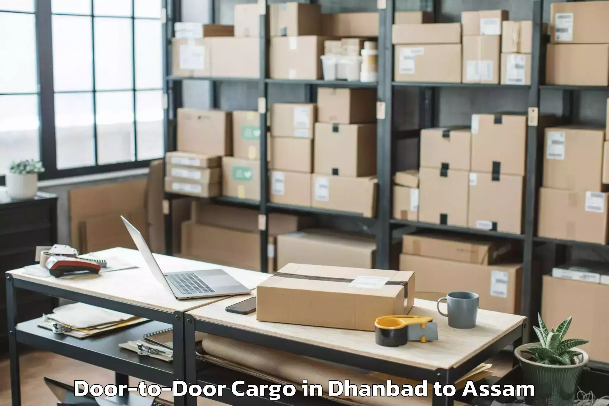 Top Dhanbad to Fekamari Door To Door Cargo Available